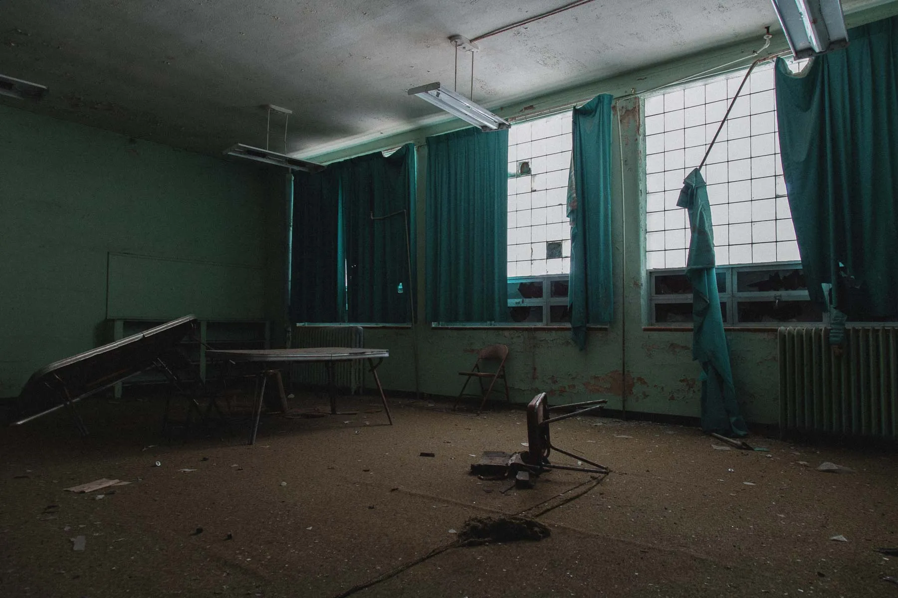 Curtained classroom corner with a lone chair inside Ayrshire school