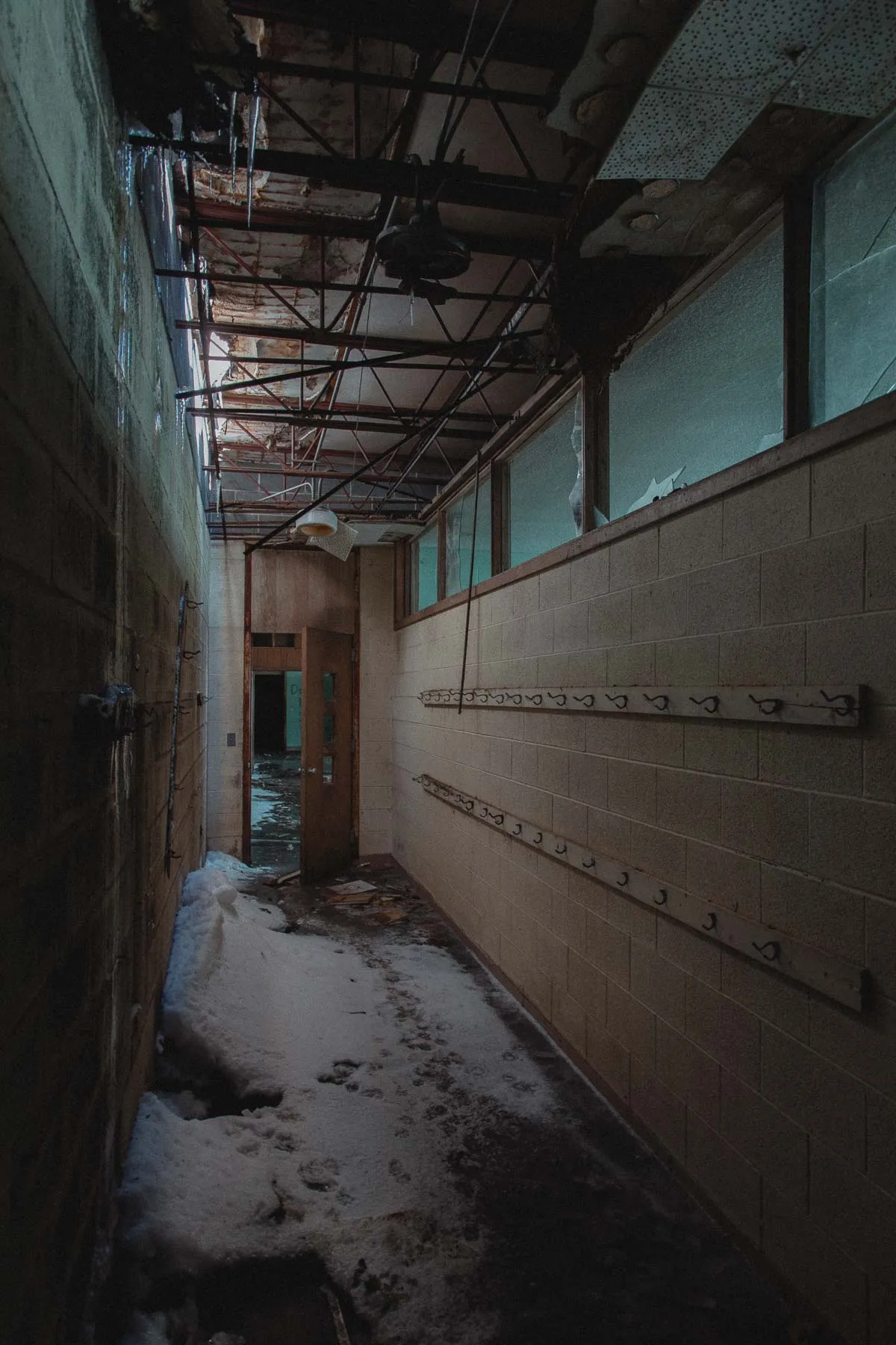 Snow dusting the hallway of the abandoned Ayrshire Consolidated School