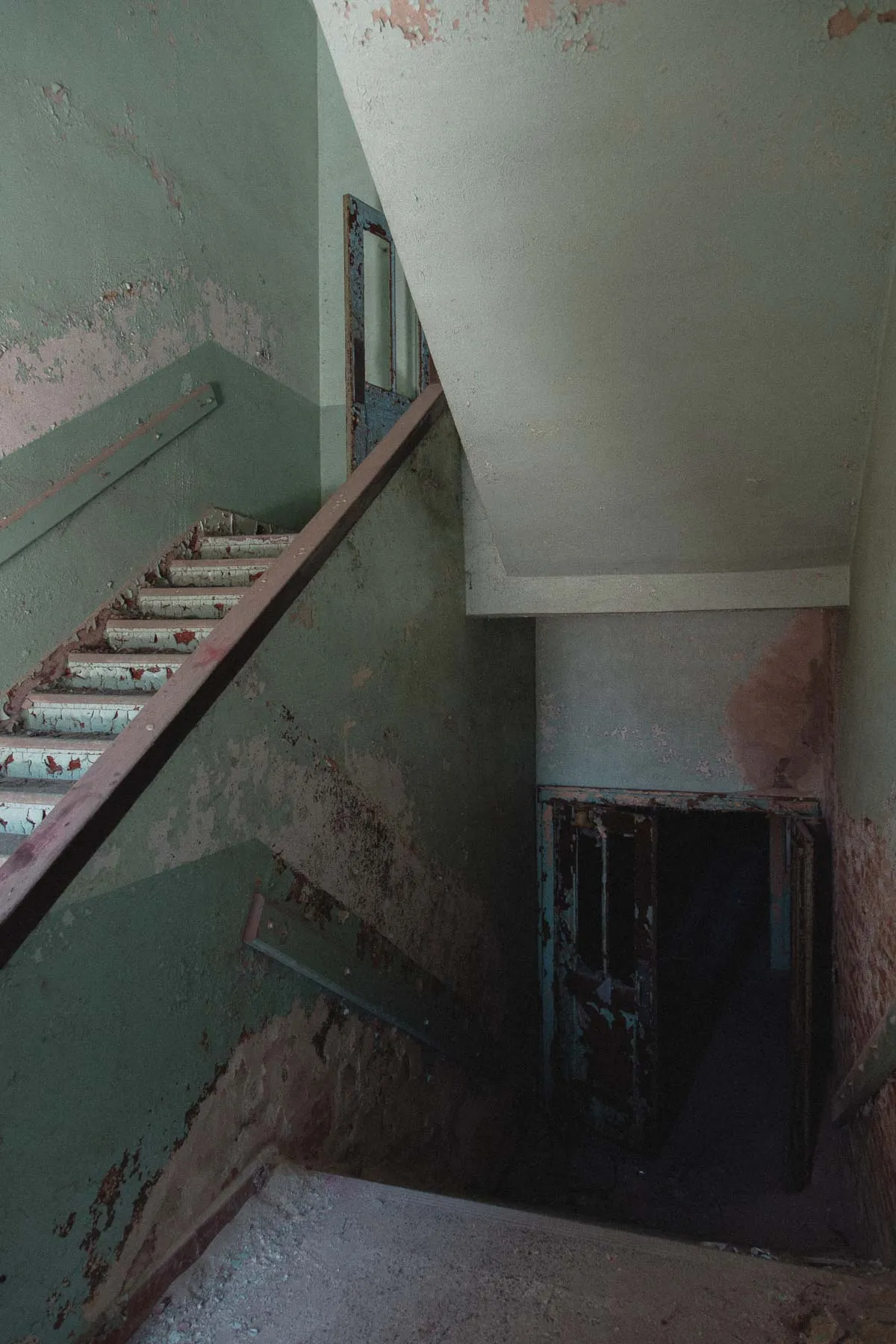 Peeling paint along the central stairwell inside Ayrshire Consolidated School