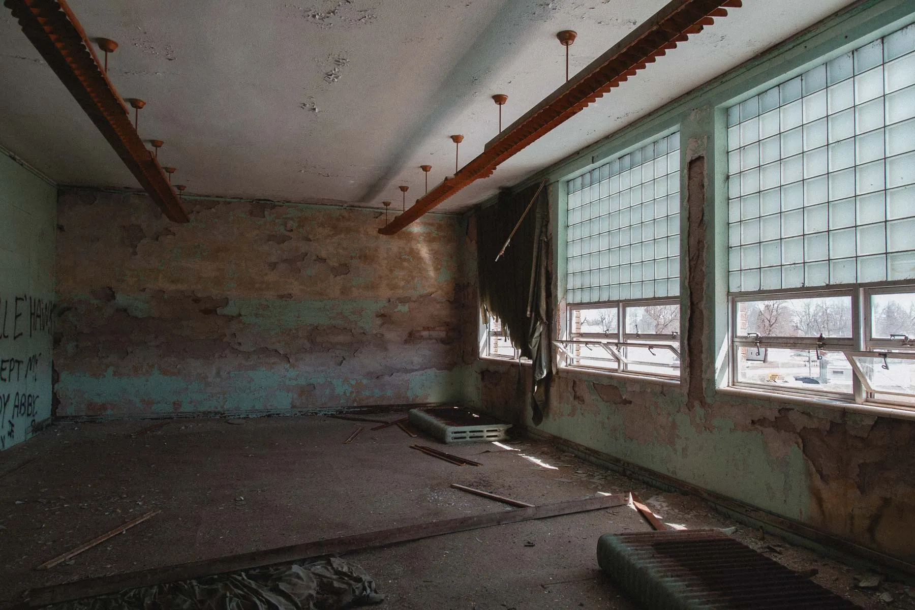 Teal-painted classroom with chalkboard maps in Ayrshire school