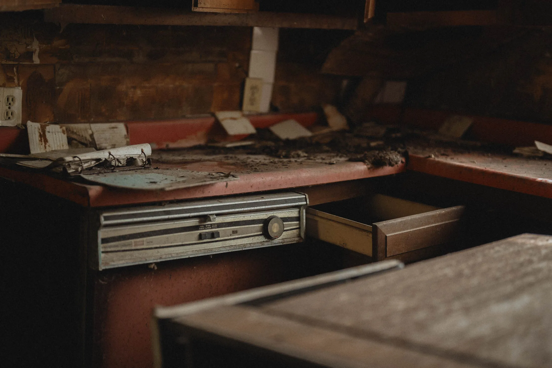 Kitchen with red vintage dishwasher and matching countertop, abandoned Finger Lakes farmhouse