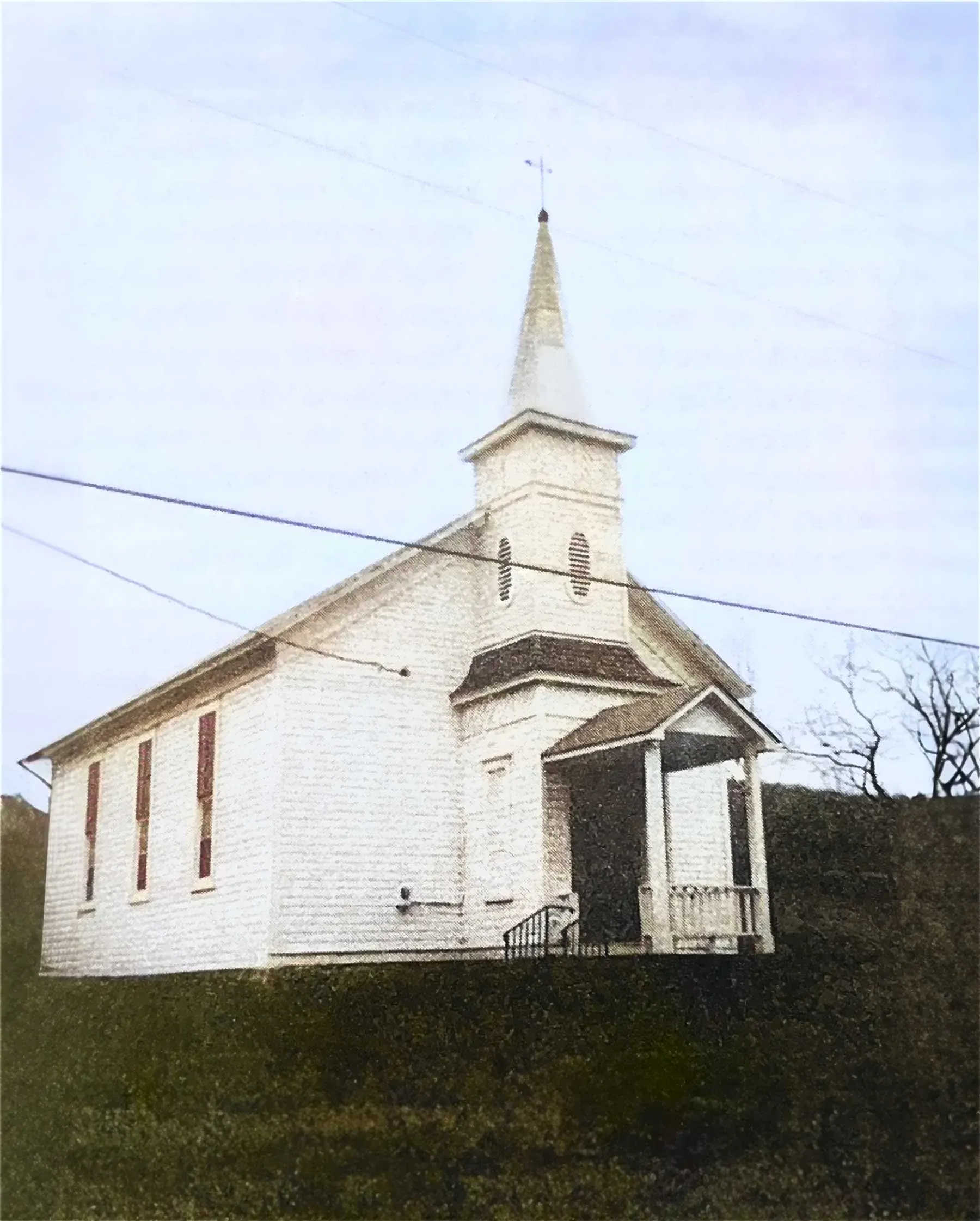 Historic photograph of Cadis Baptist Church with congregants and horse-drawn carriages