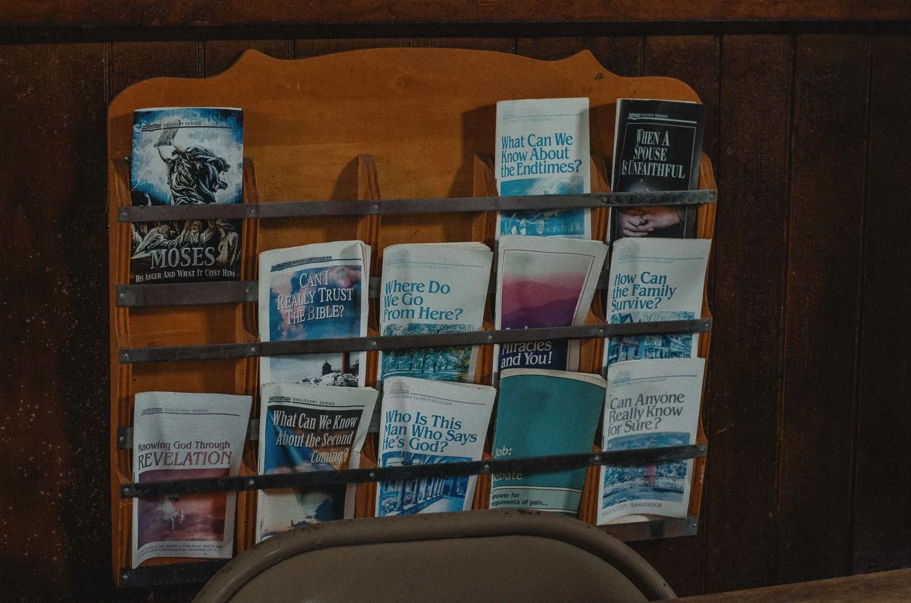Religious pamphlets stacked on a wooden table at Cadis Baptist Church
