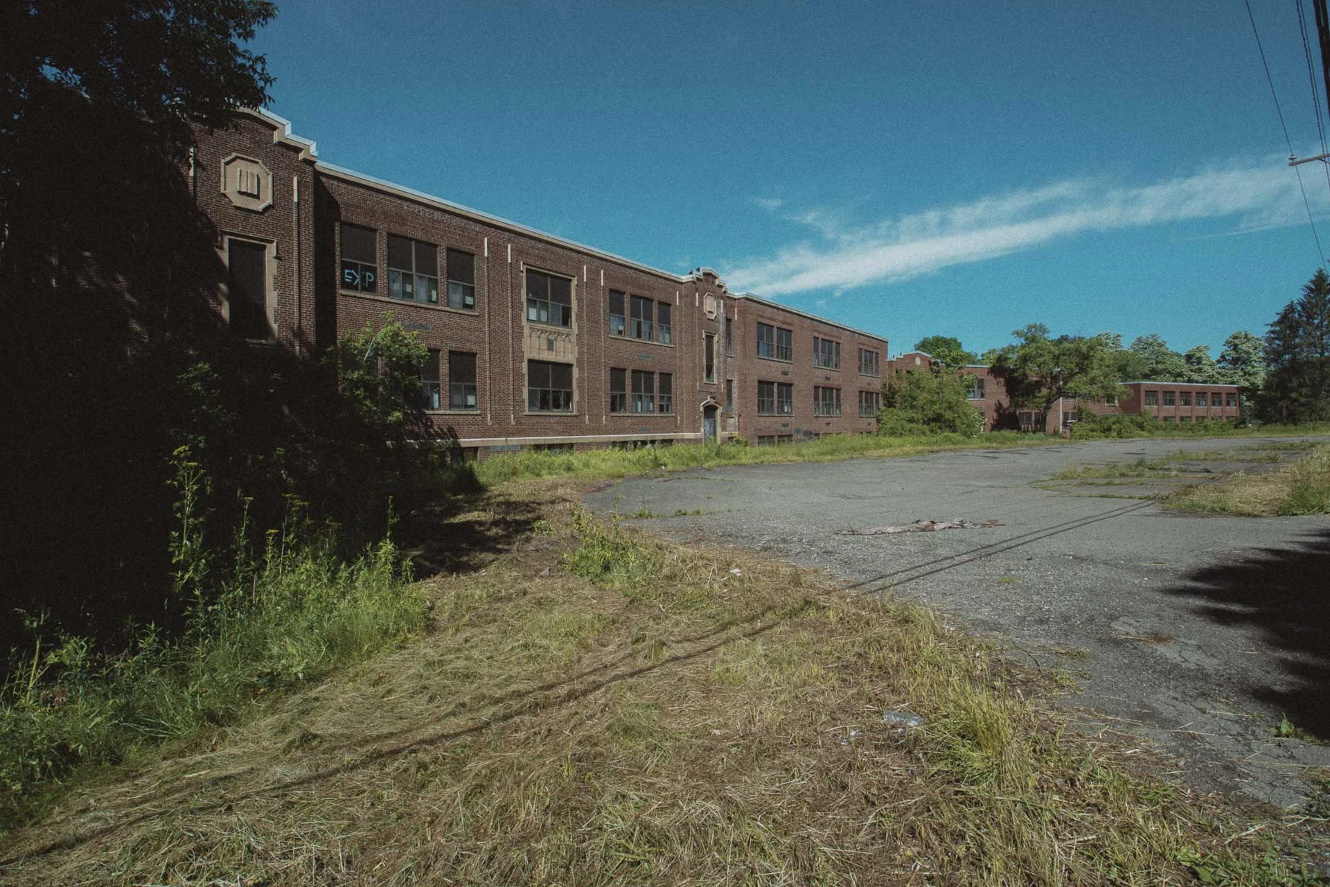 Brick facade of the abandoned Charlotte Kenyon Elementary School in Chenango Forks, New York