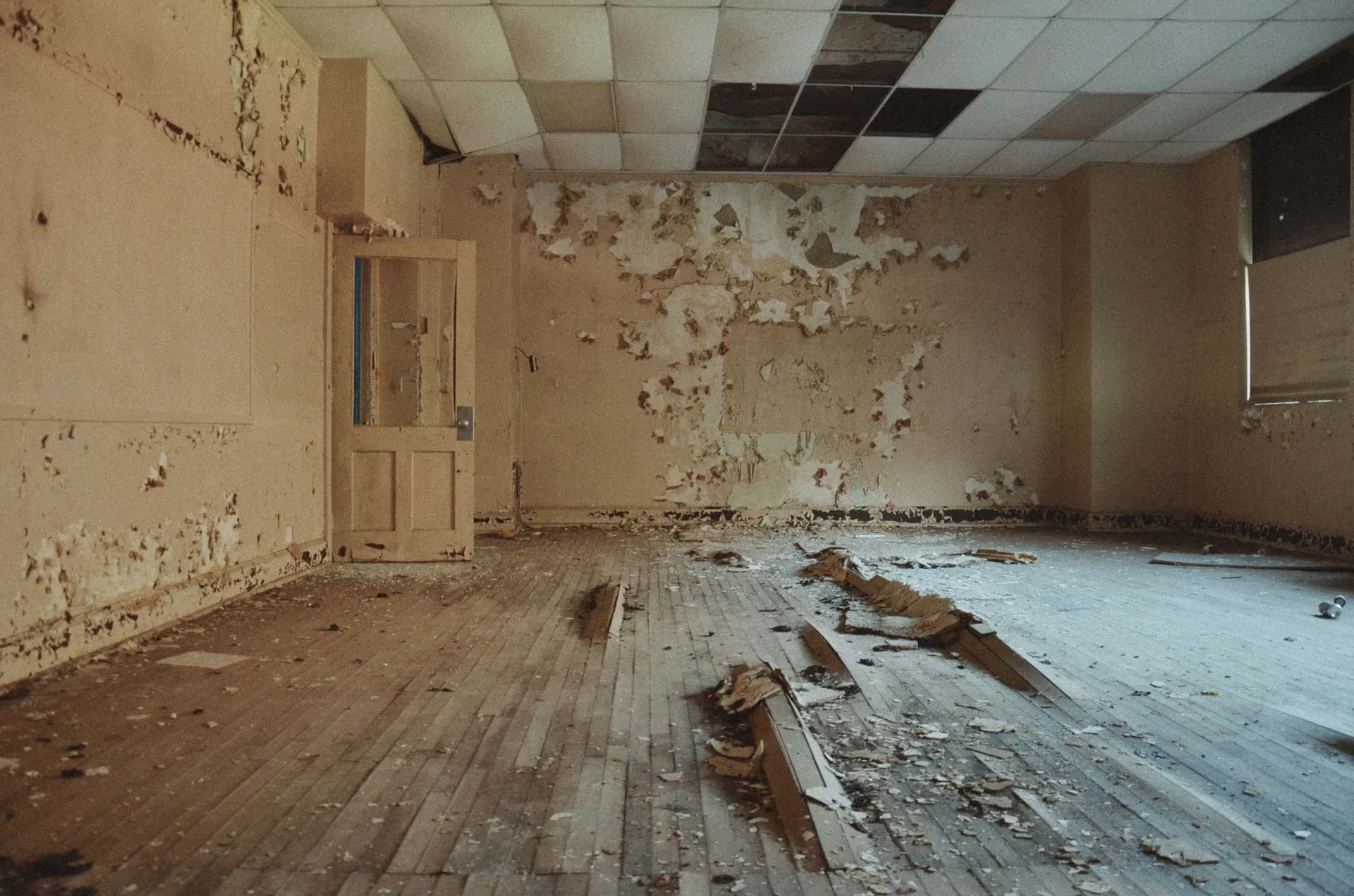 Upper-level classroom lined with desks inside Charlotte Kenyon Elementary School