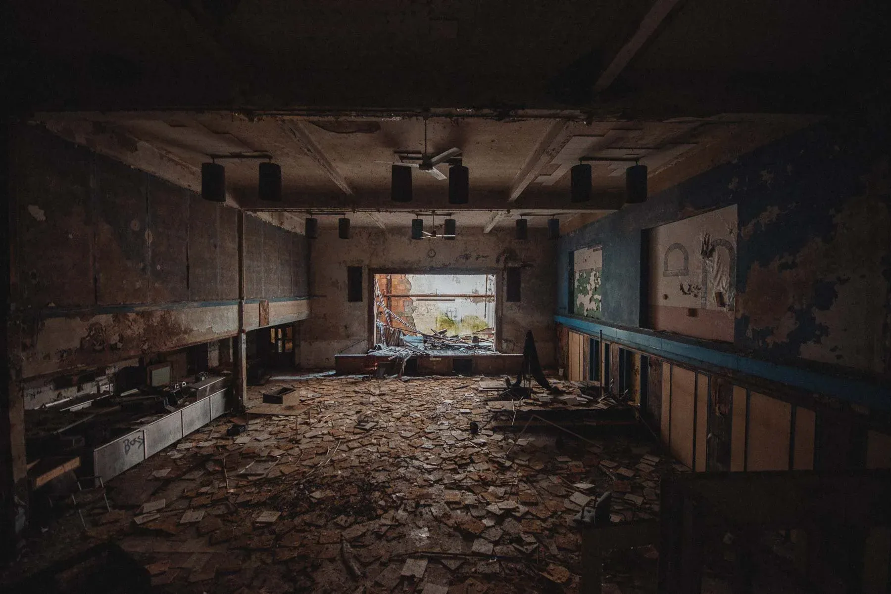 Gymnasium and cafetorium stage inside the abandoned Columbus School