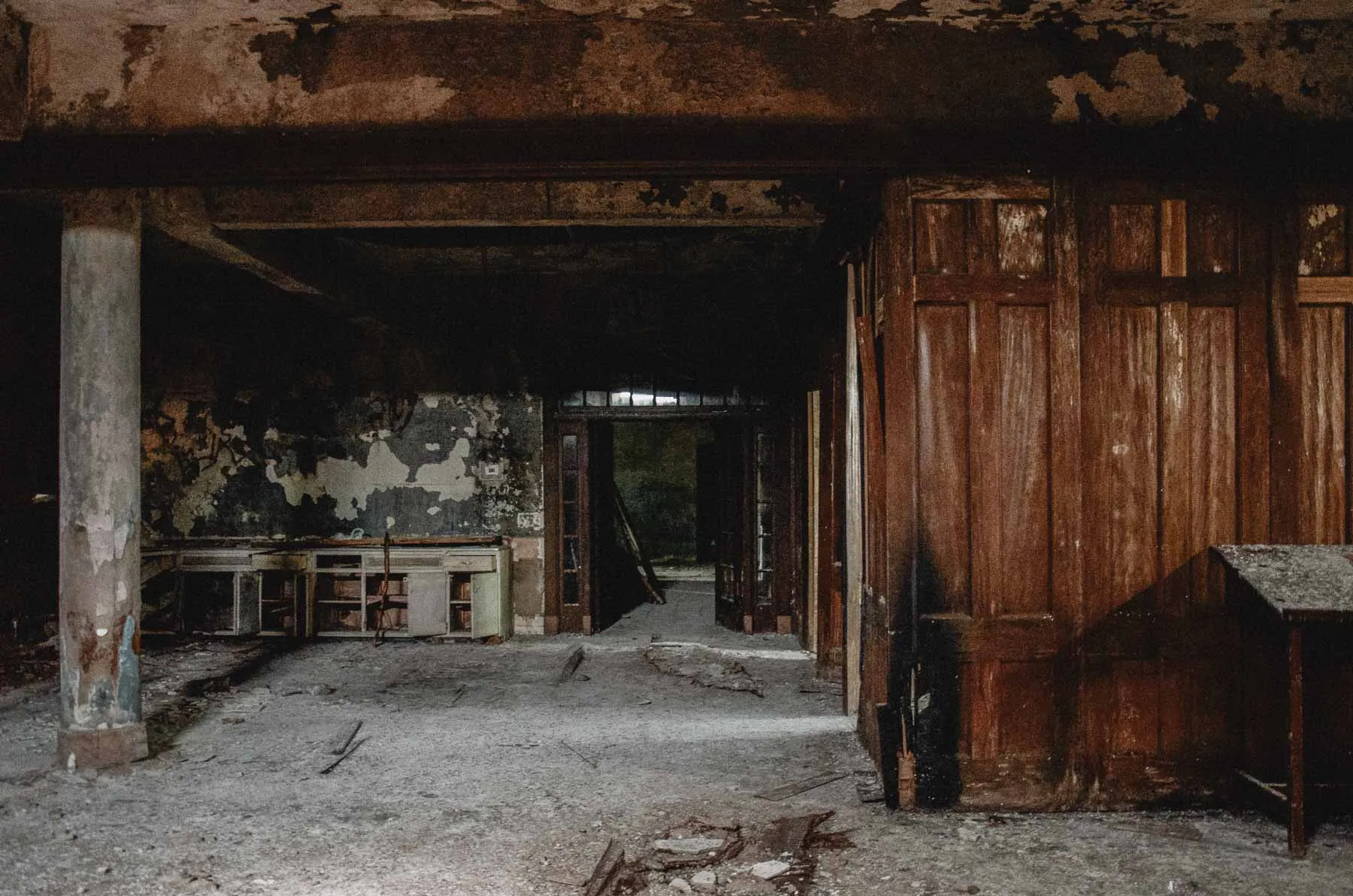 Basement corridor with exposed piping inside the synagogue