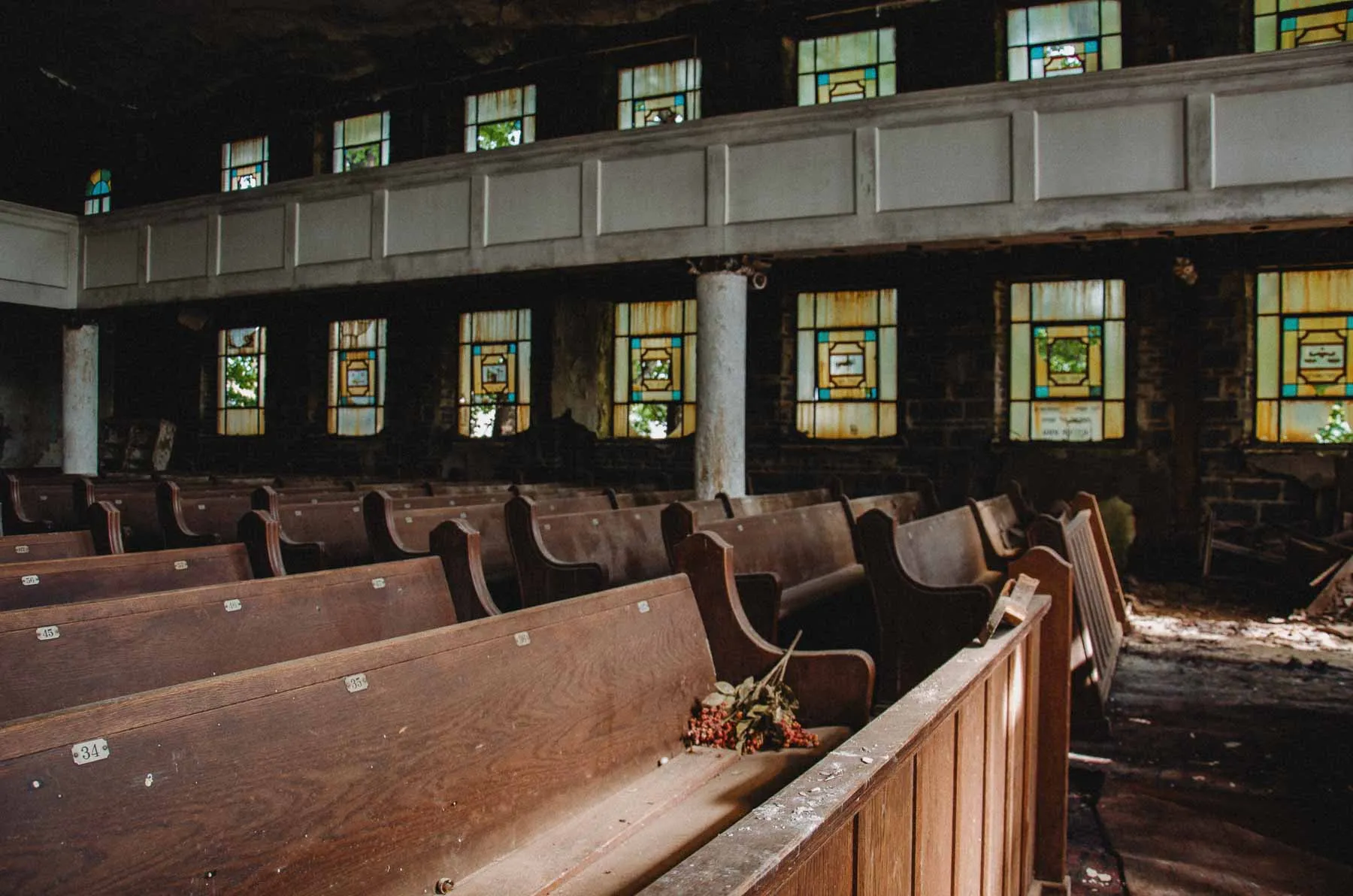 Prayer hall of Congregation B'Nai Israel with wooden pews and flanking columns