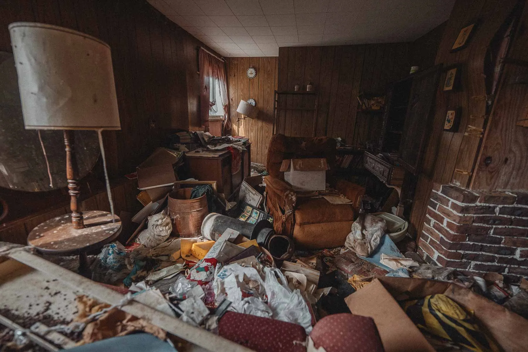 Disorganized retro living room inside the Dog House barndominium in Upstate New York