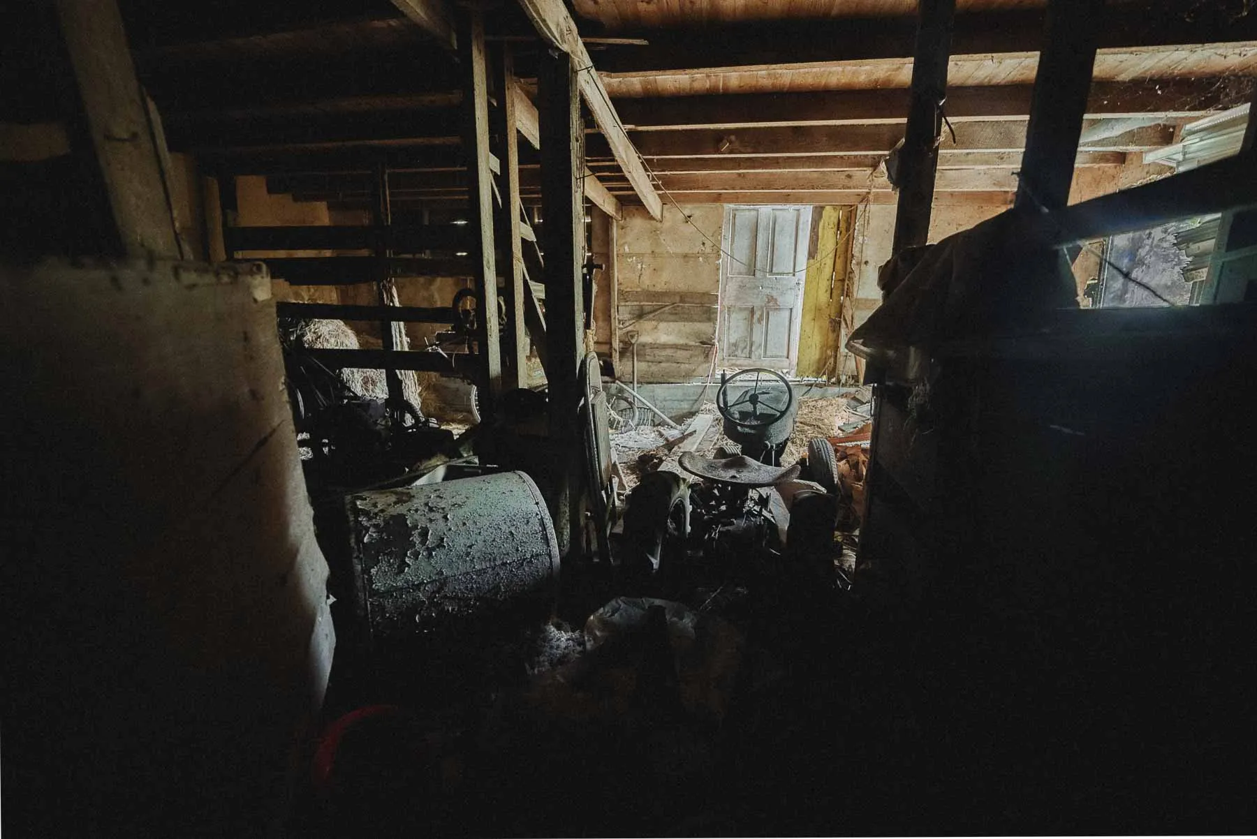 Wheel Horse tractor stored inside the barn section of the Dog House property