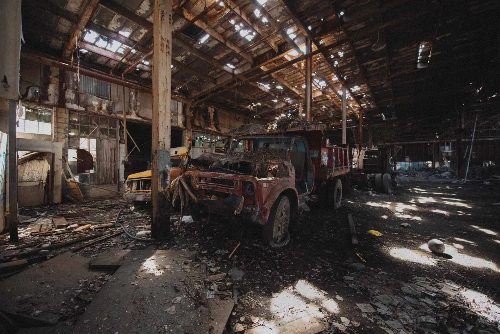 Stripped Chevrolet C60 dump truck parked inside the former D.W. Winkelman Co. warehouse
