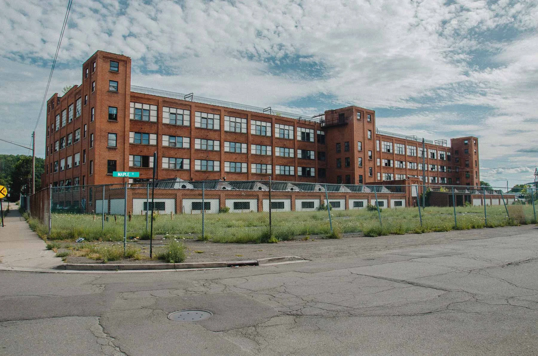 Facade of the Endicott-Johnson Fair Play Factory with the main entrance canopy in West Endicott