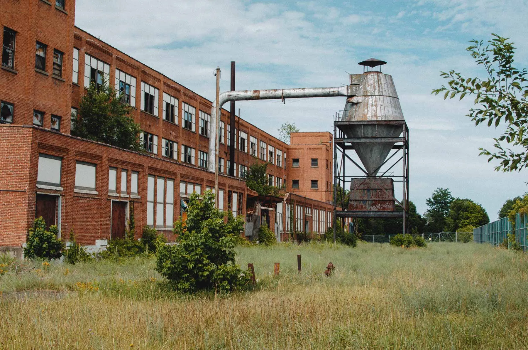 Exterior wall lettering identifying the Fair Play Factory as part of Endicott Johnson Shoe