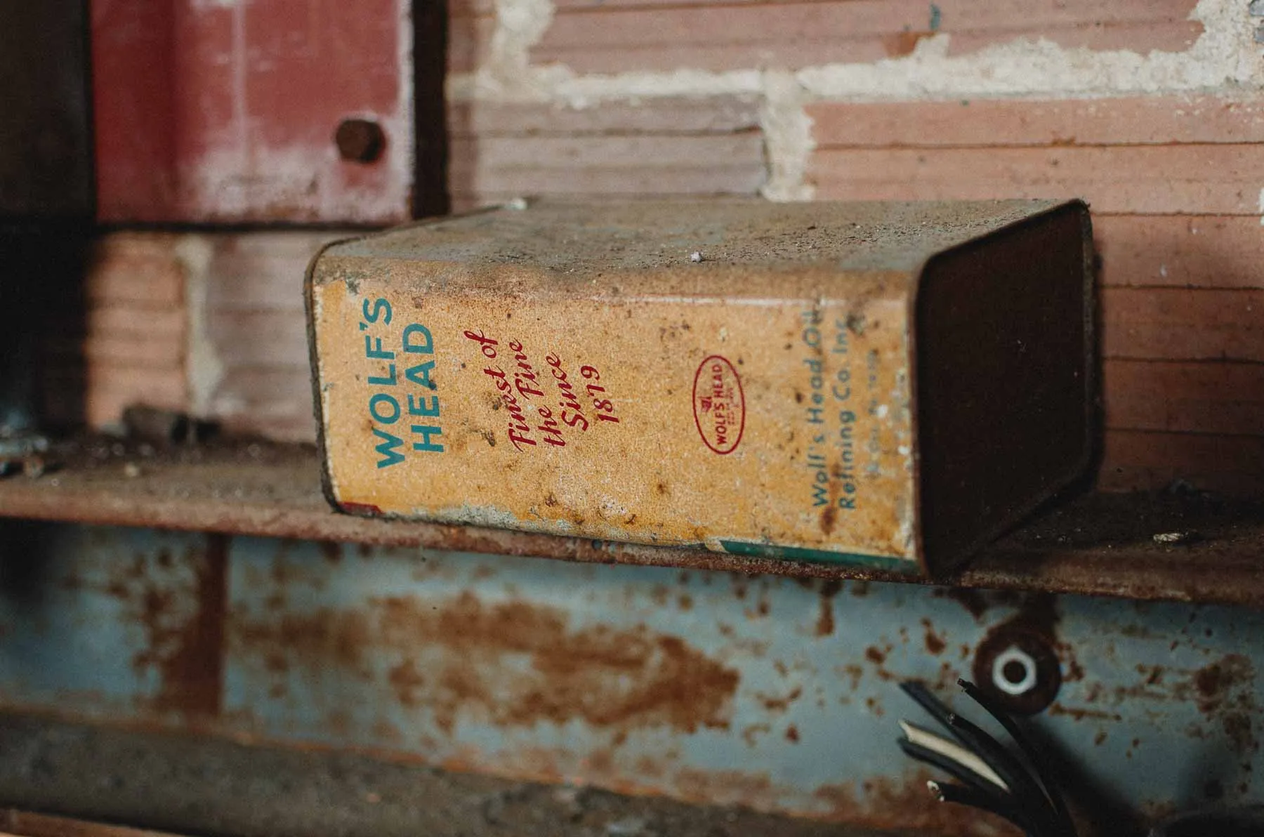 Wolf's Head motor oil can left behind on a Fair Play Factory workbench