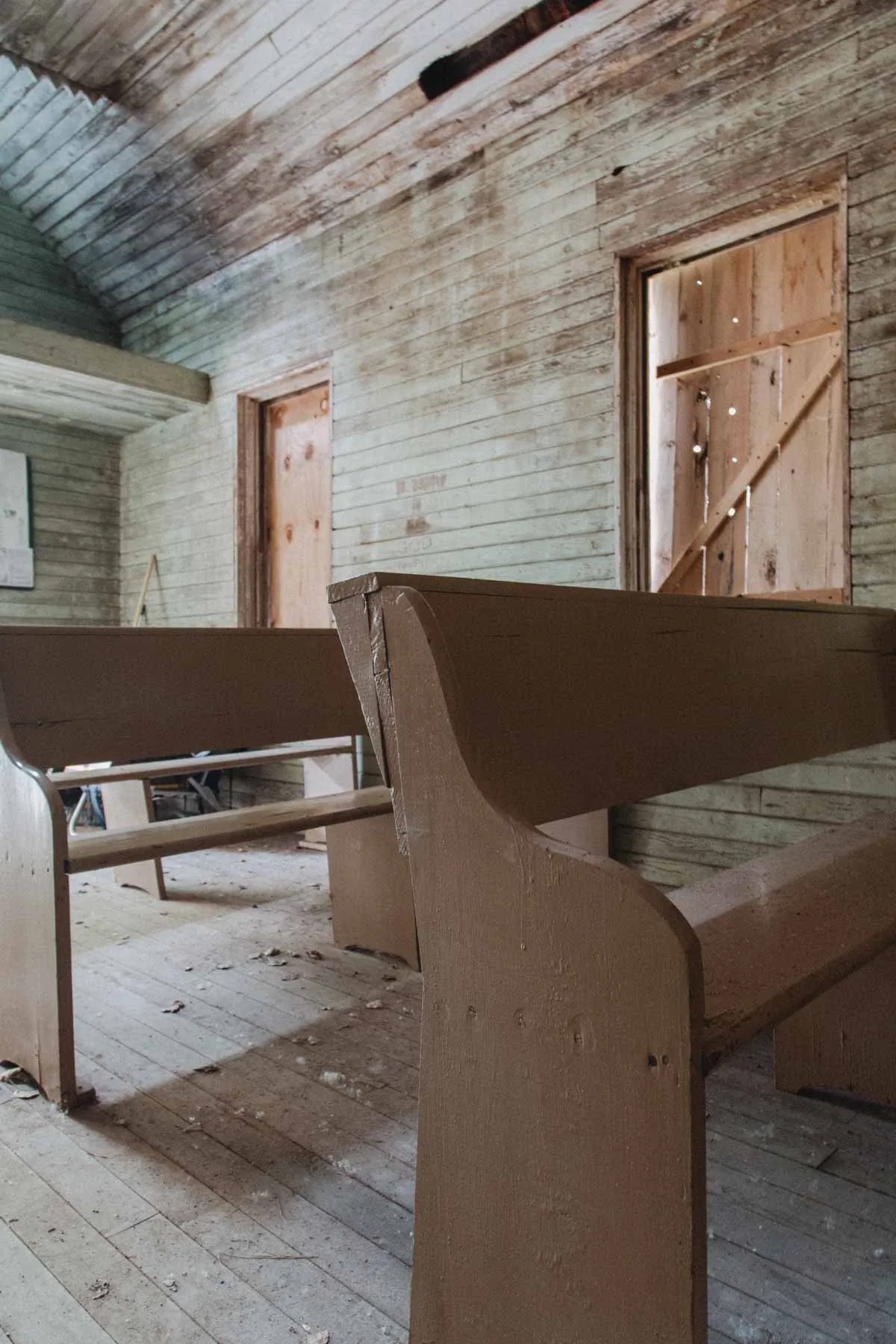 Simple wooden pews and altar rails inside the Estonian Evangelical Martin Luther Church