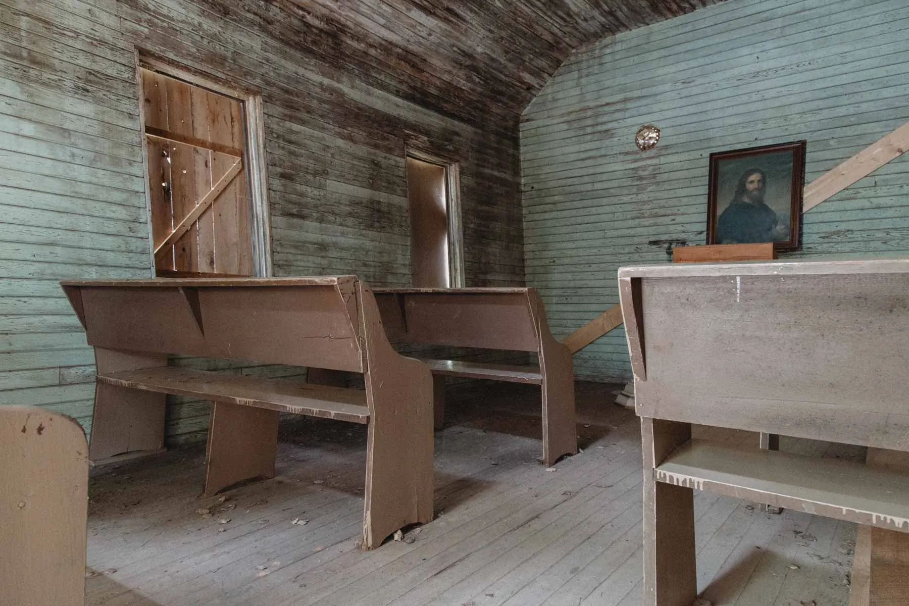Peeling blue paint along the nave inside the Estonian Evangelical Martin Luther Church