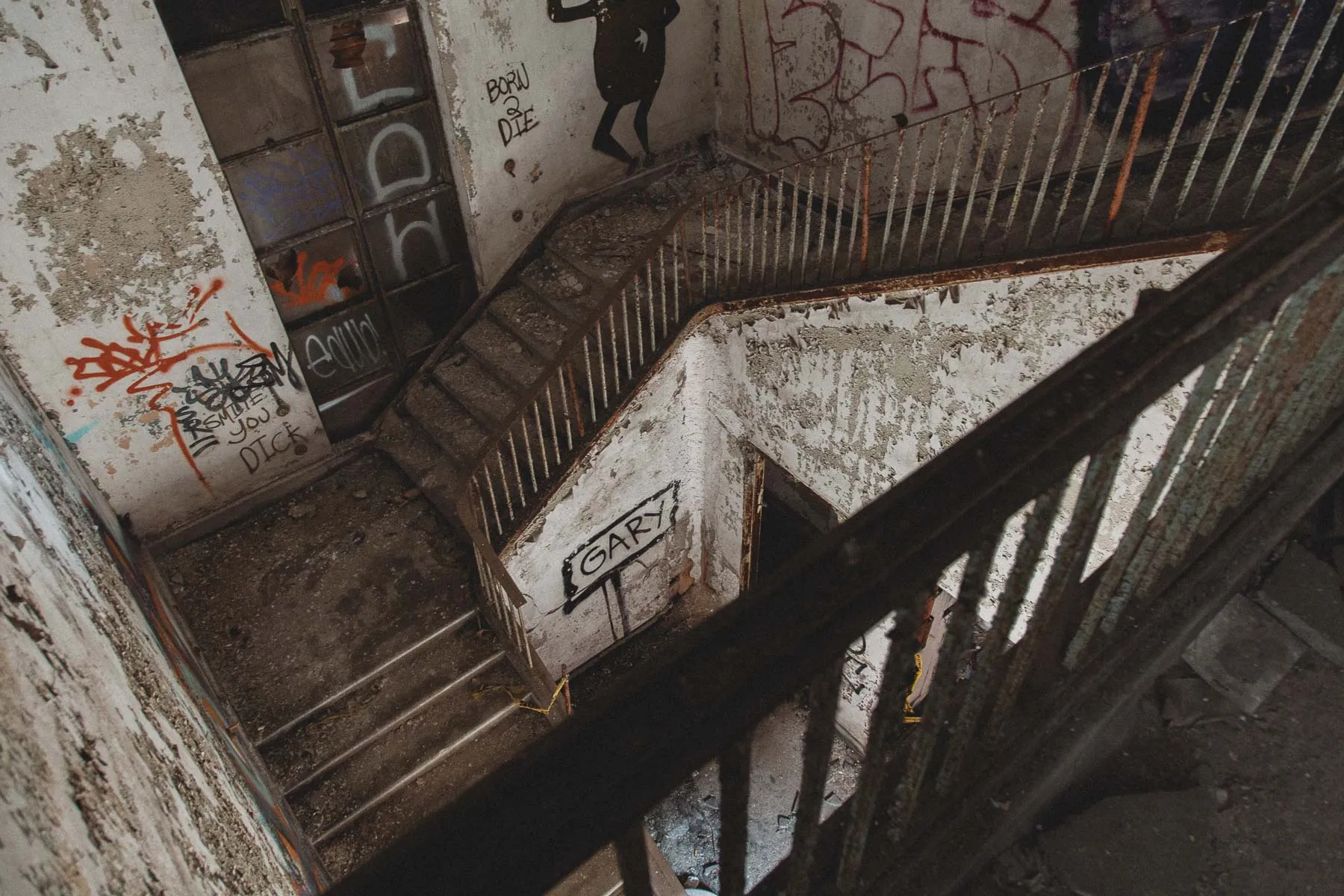 U-shaped staircase with peeling paint inside the Gary United States Post Office