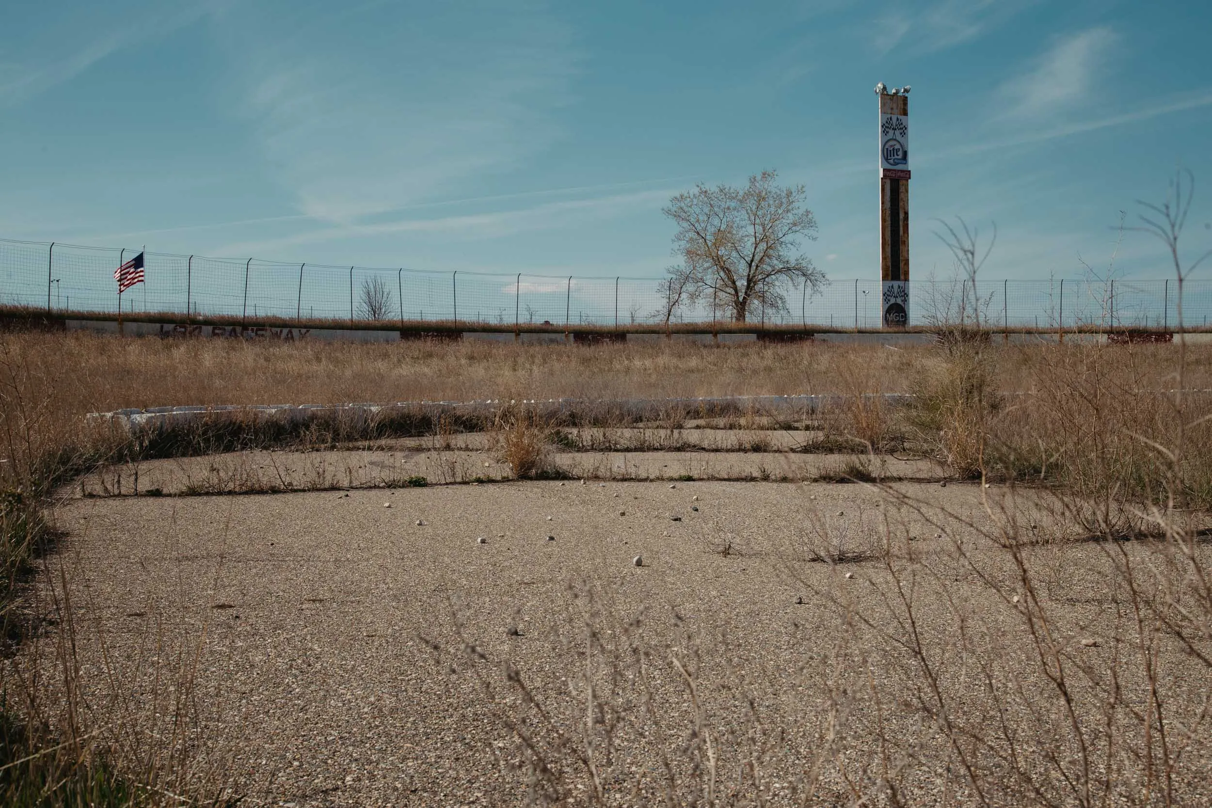 Cracked asphalt racing surface at the abandoned I-94 Speedway