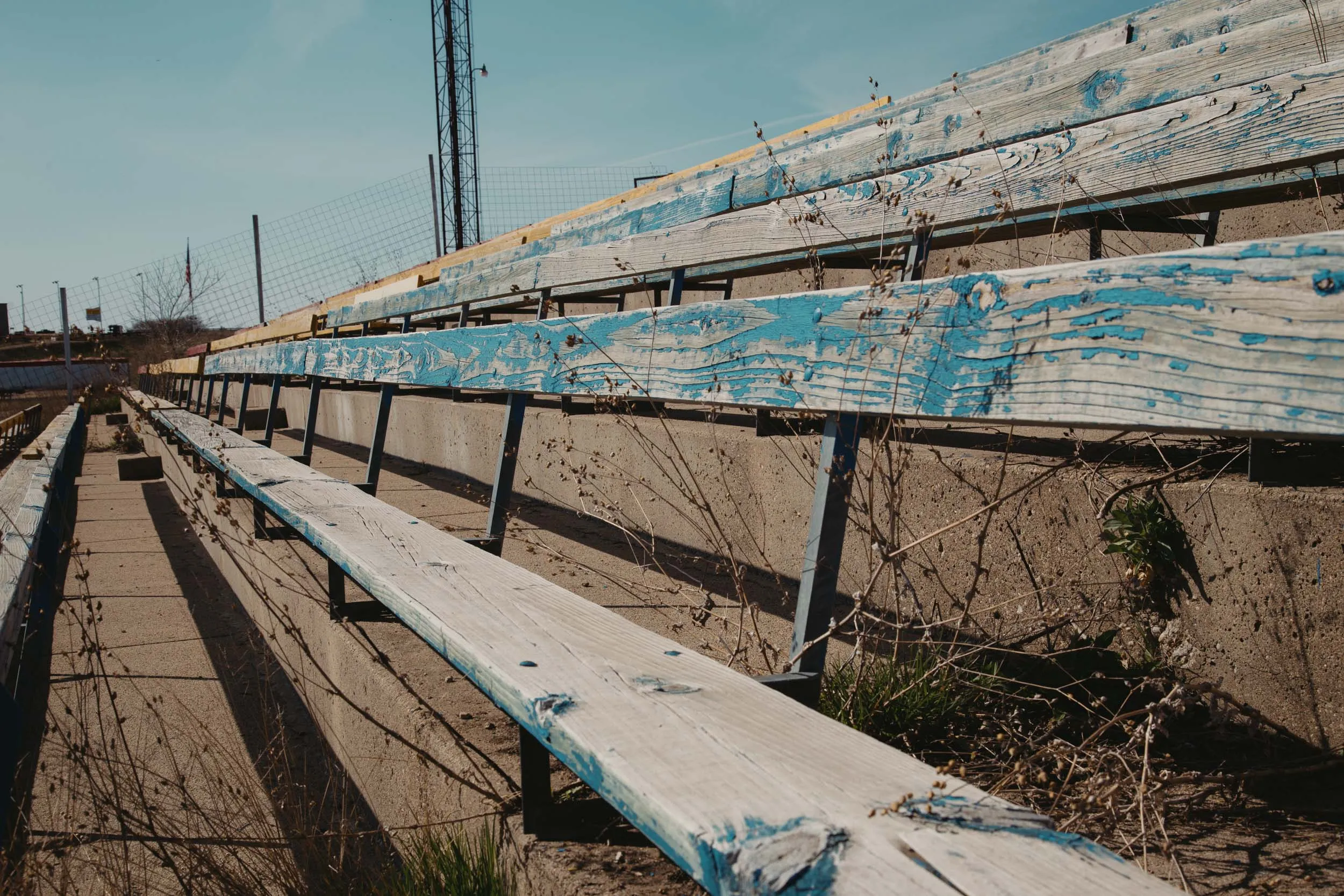 Blue spectator grandstand overlooking turn four at I-94 Speedway