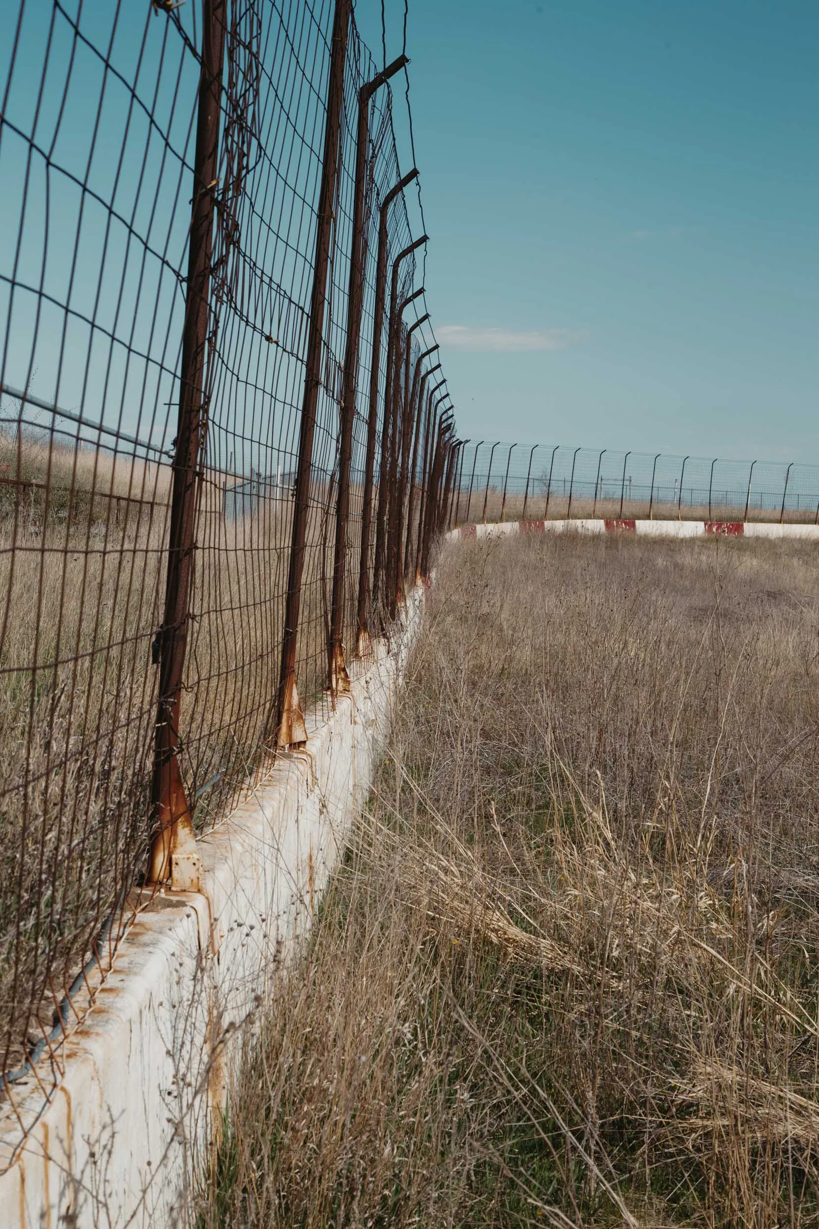 Catch fence guarding the abandoned I-94 Speedway front stretch