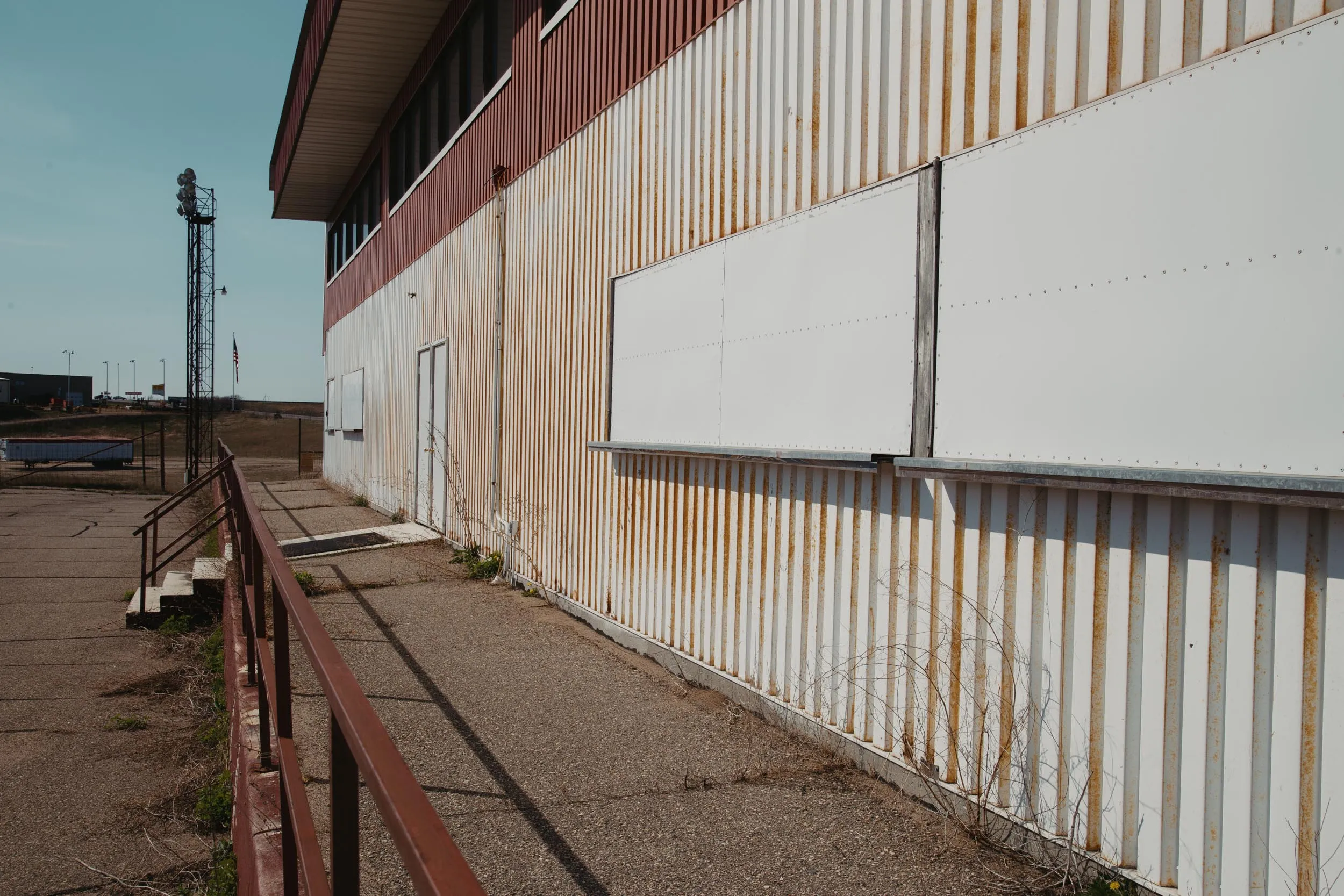 Closed concession stand with shuttered windows at I-94 Speedway