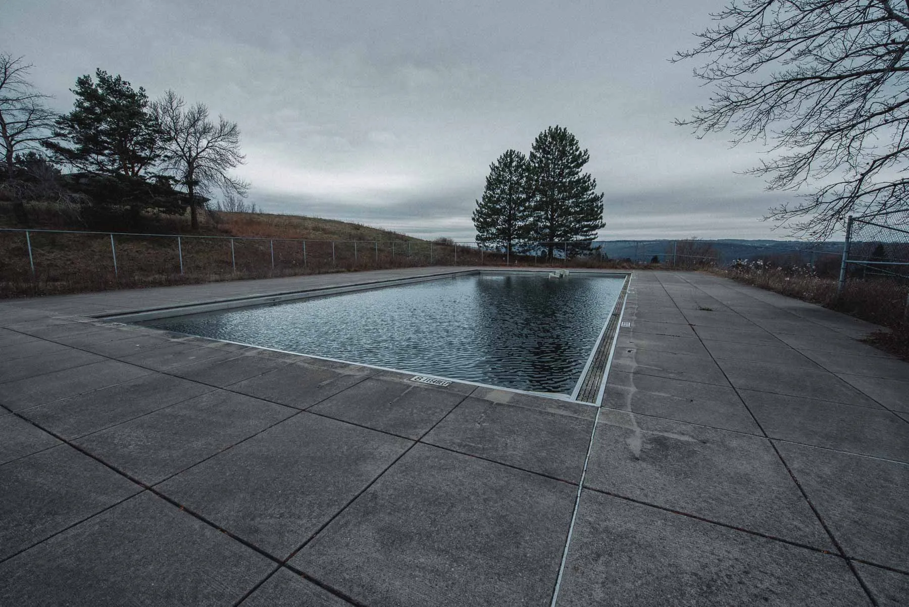 Abandoned main pool with a collapsed awning at LaFayette Hills