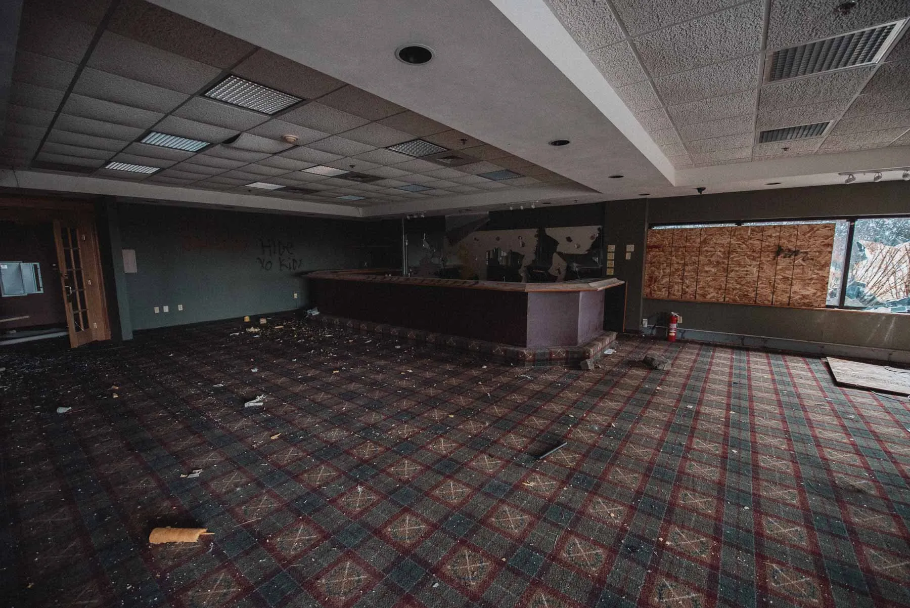 Club bar with glassware inside the abandoned LaFayette Hills Golf Country Club