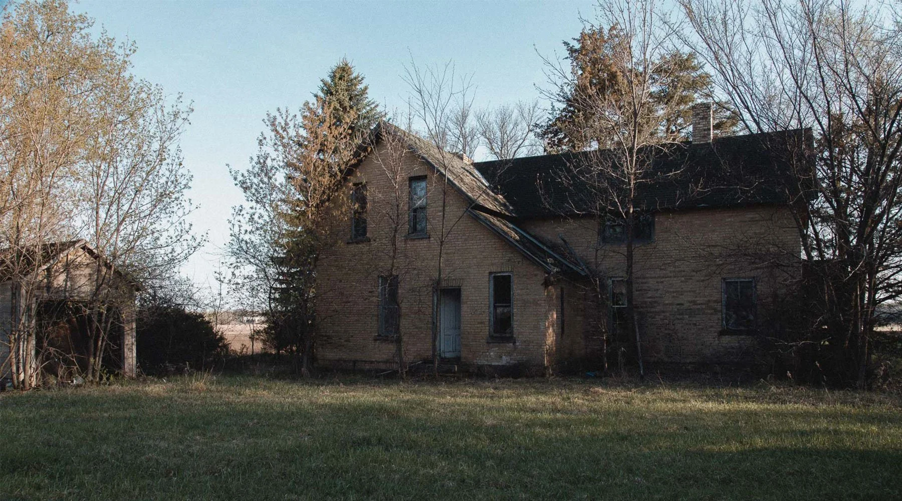 Yellow brick farmhouse at Landwehr Century Farm in St. Augusta, Minnesota