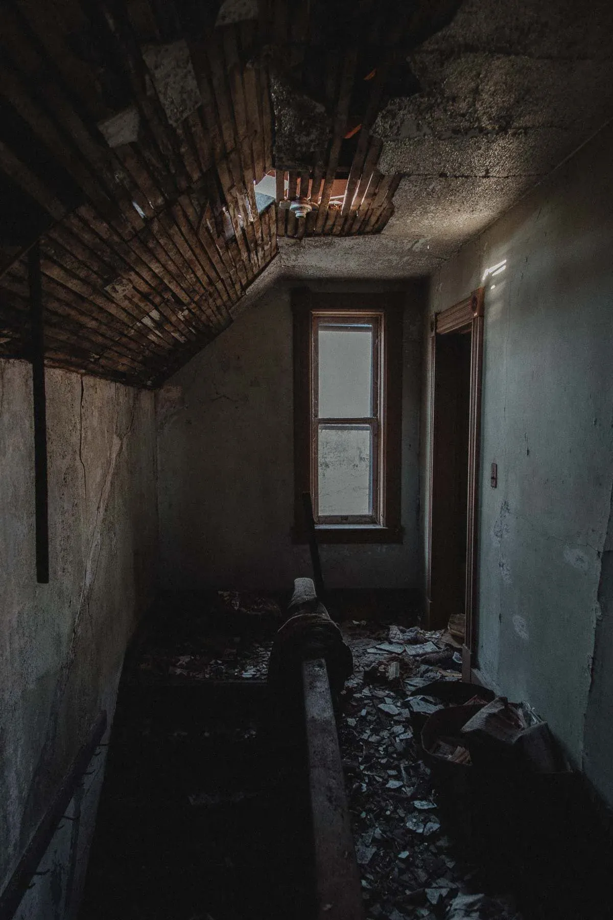Upstairs hallway staircase lit by a skylight at Landwehr Century Farm