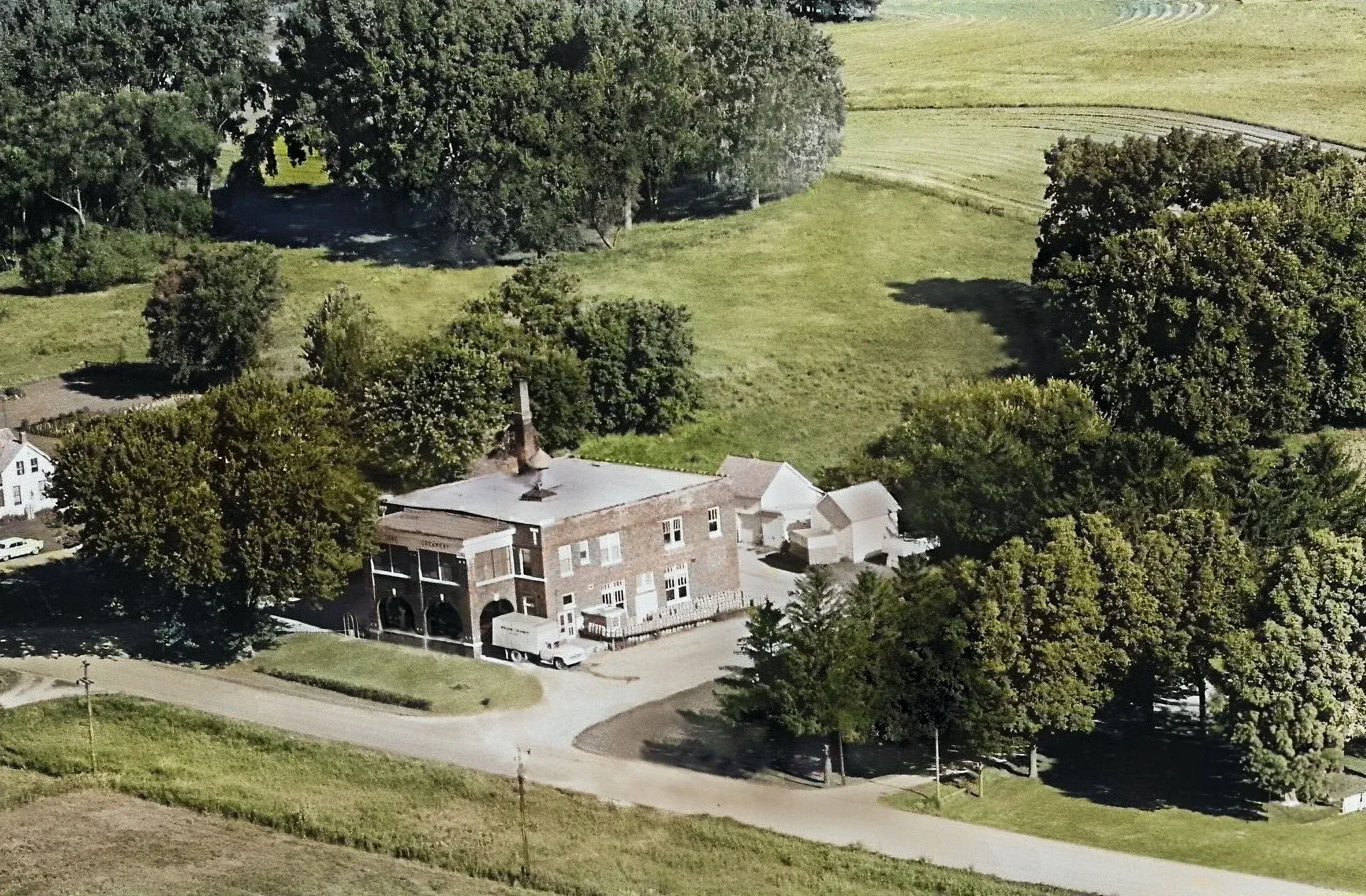 1967 aerial photograph depicting Moland Creamery and surrounding property