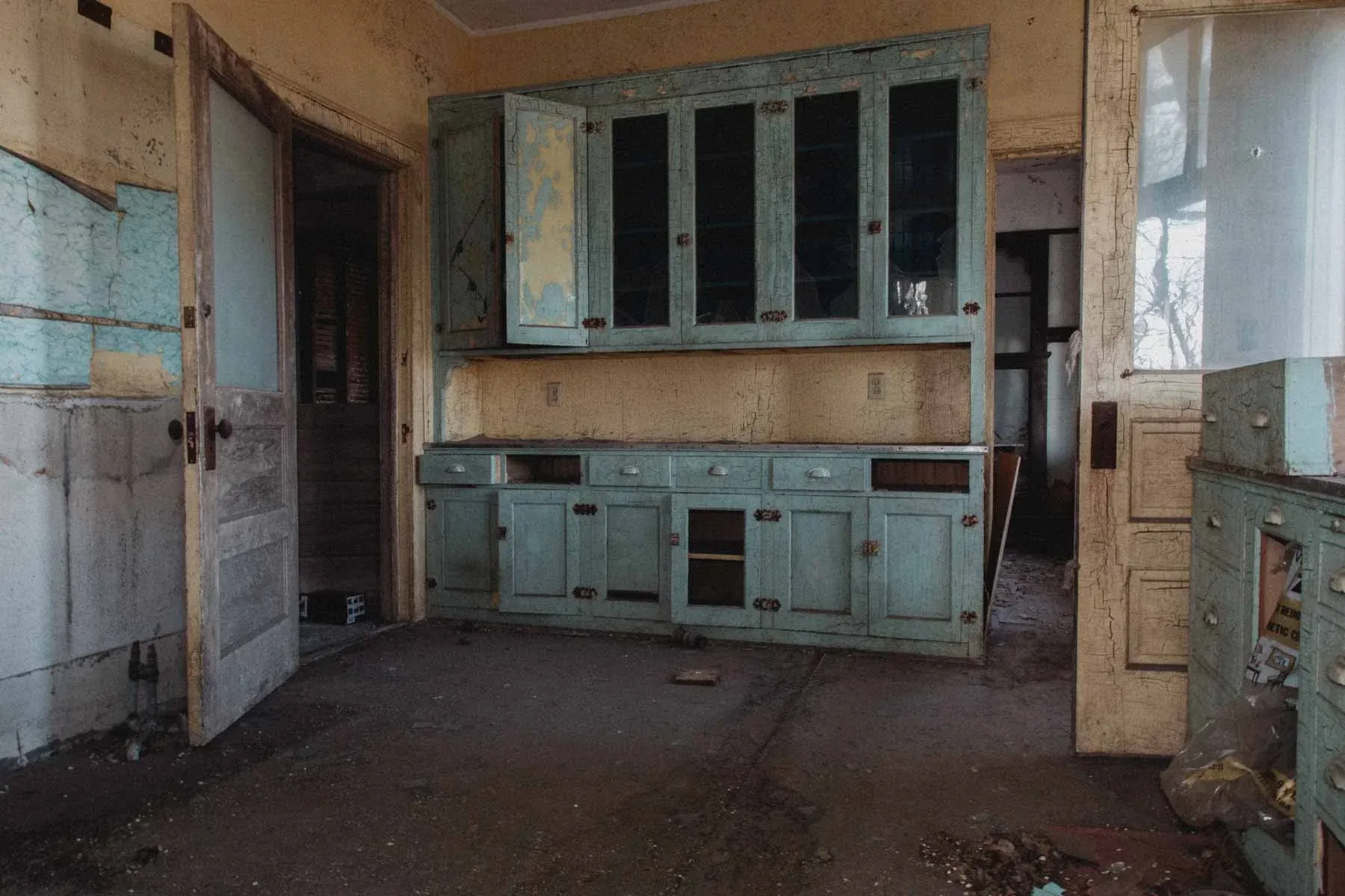 Butter maker's kitchen cabinets inside Moland Creamery living quarters