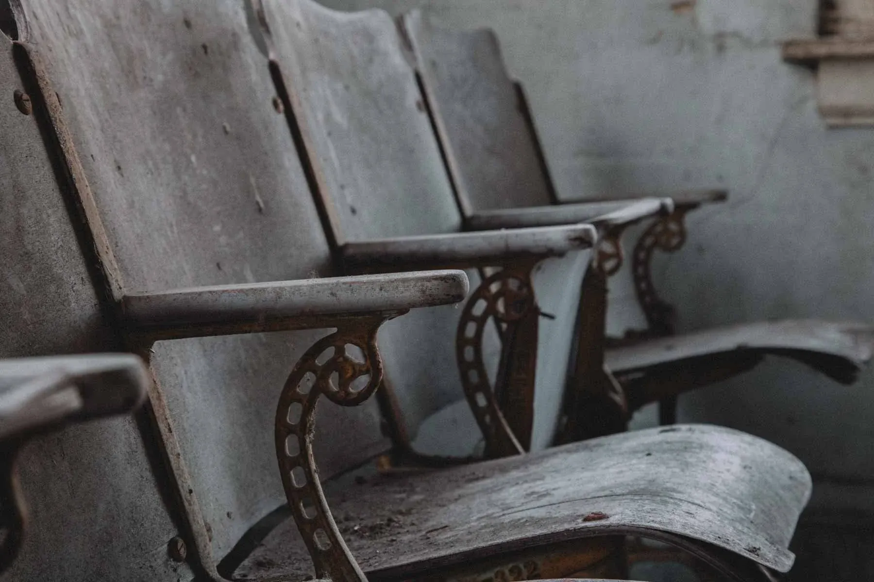 Cast-iron theater chairs lining the balcony inside Moland Creamery
