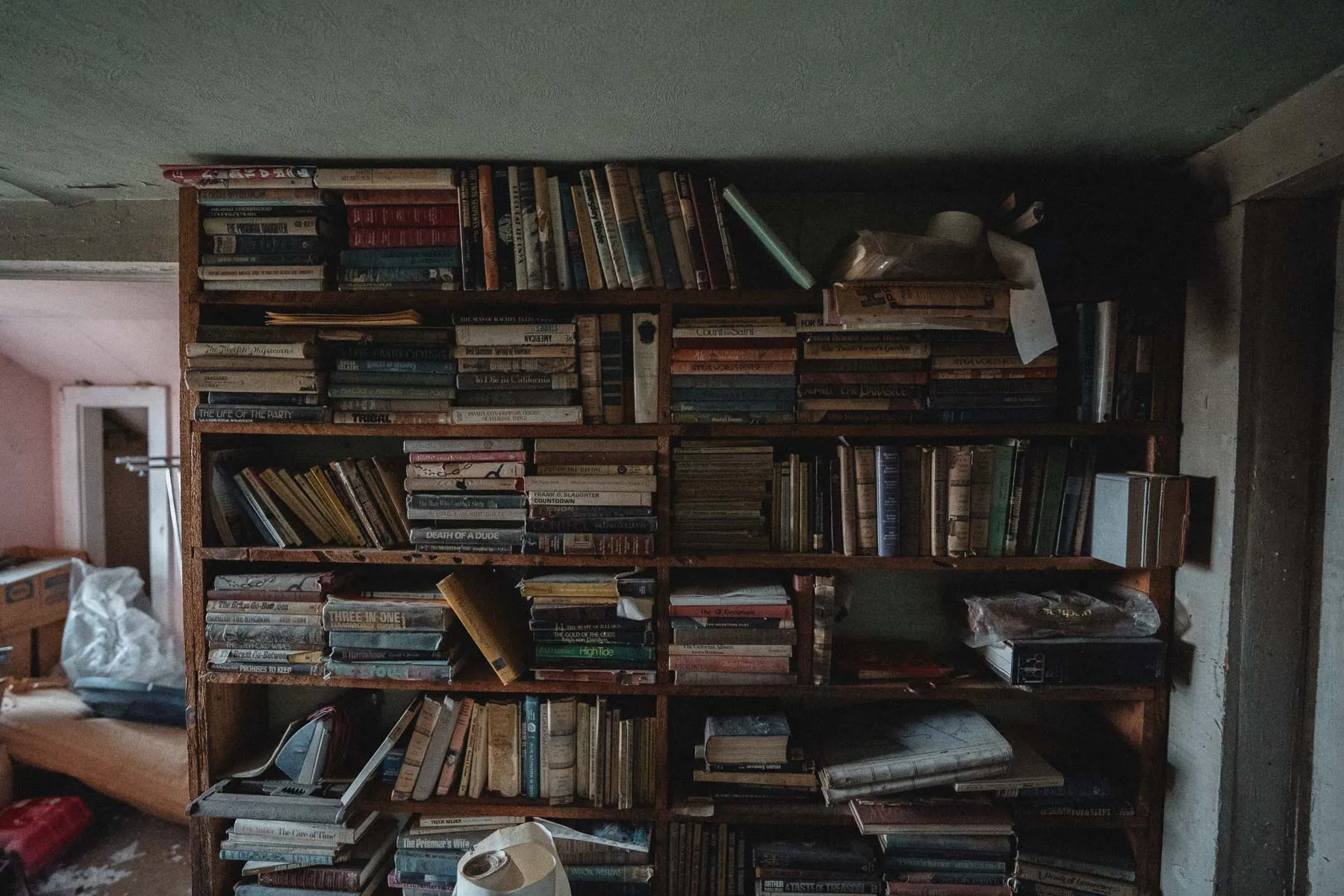 Bookshelf of mysteries collected by Marvelous Marv inside the Ransom House
