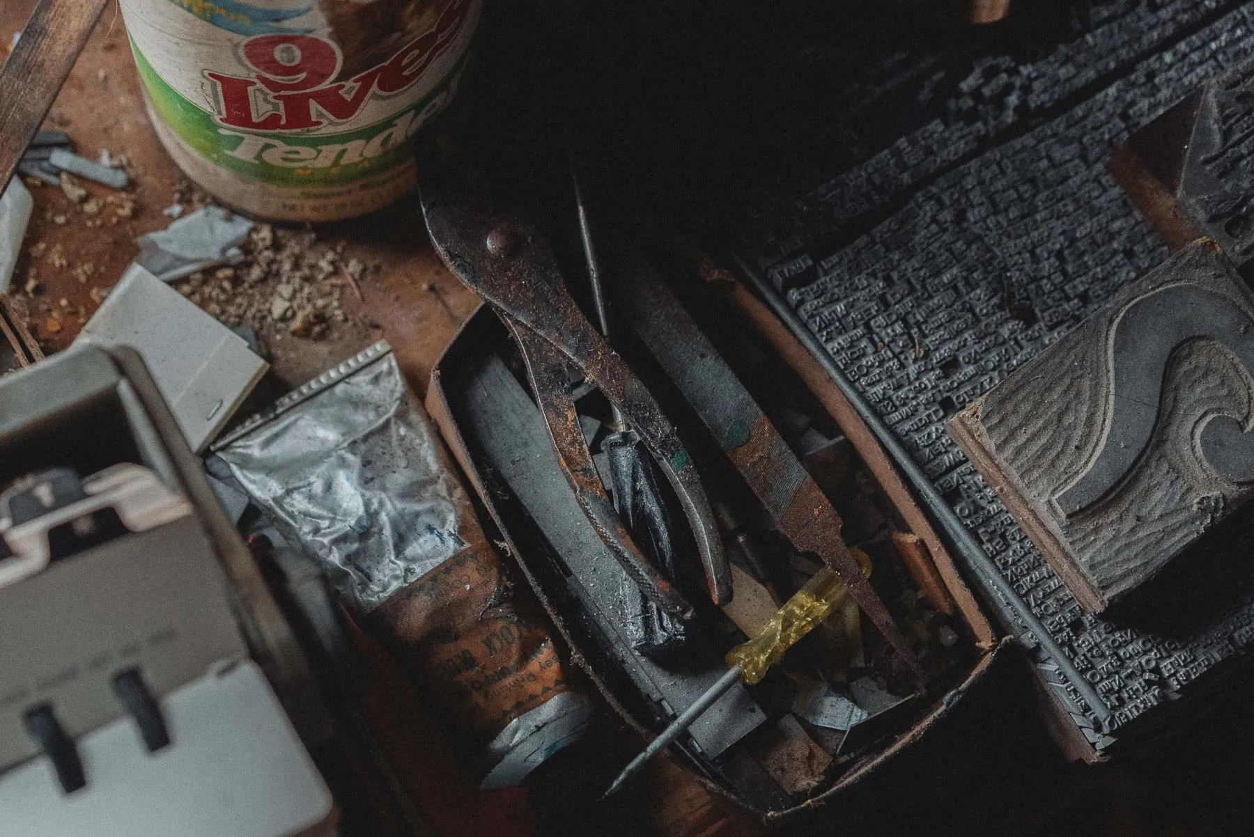 Ink, hand tools, and stamps on a workbench inside the Ransom House