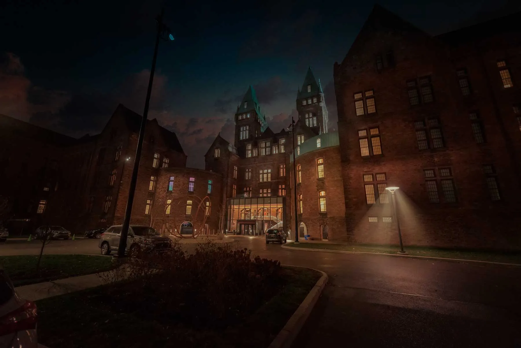 Hotel Henry entrance illuminated at night on the Richardson Olmsted Complex campus