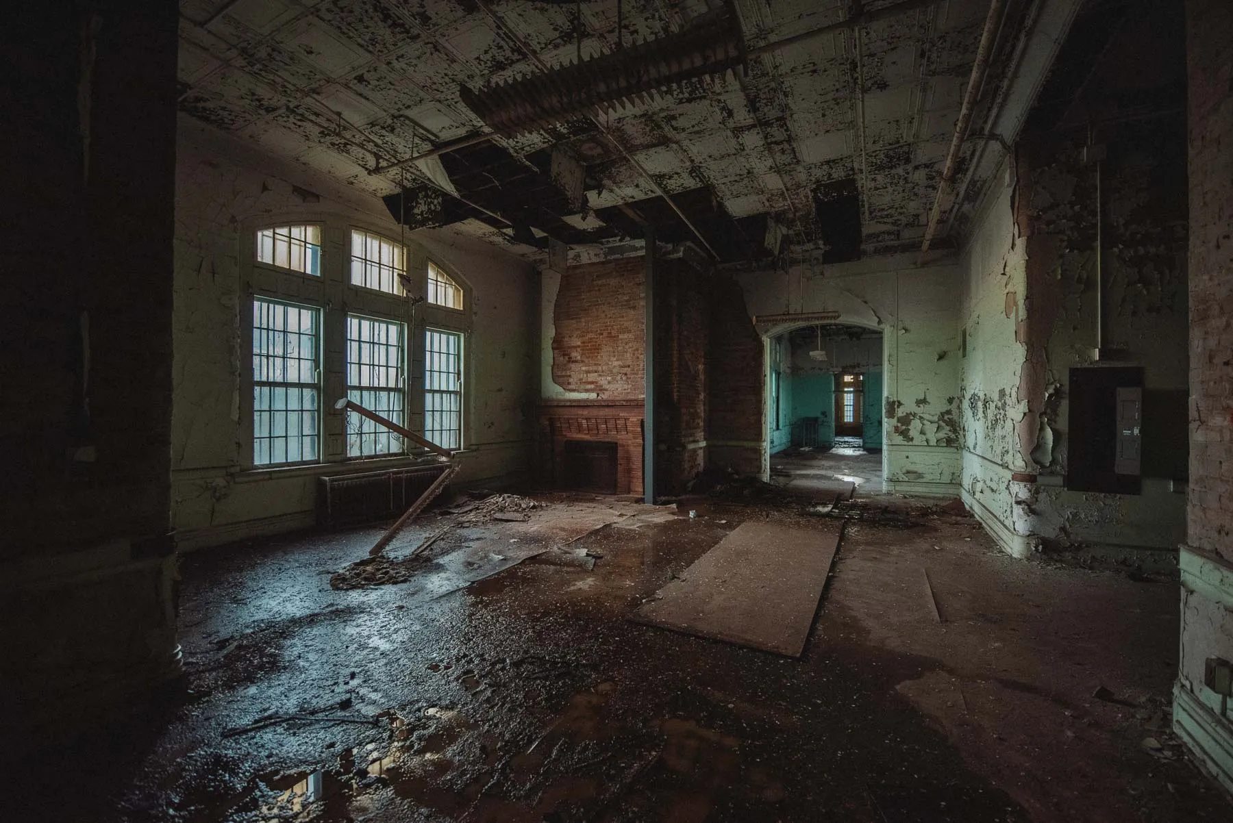 Brick fireplace in a collapsing ward inside the Richardson Olmsted Complex