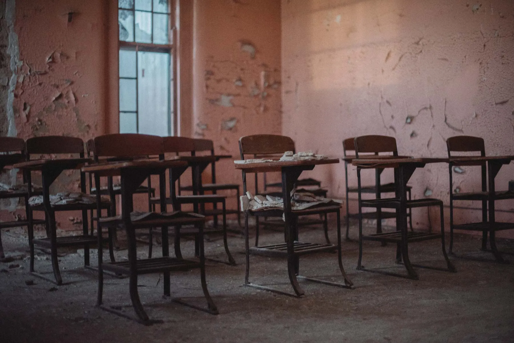 Pink classroom lined with desks inside the Richardson Olmsted Complex