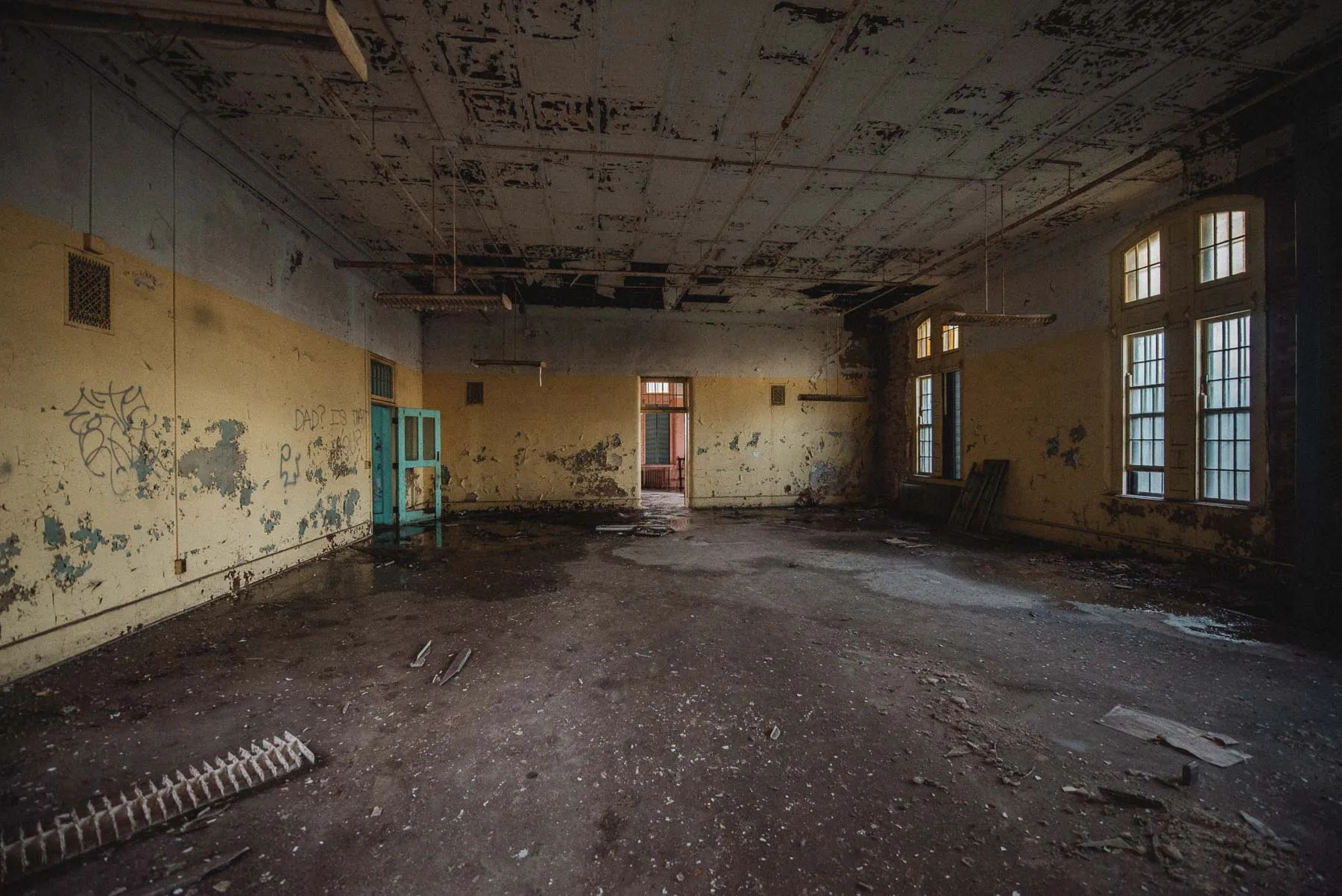 Sunlit yellow recreation room inside the Richardson Olmsted Complex