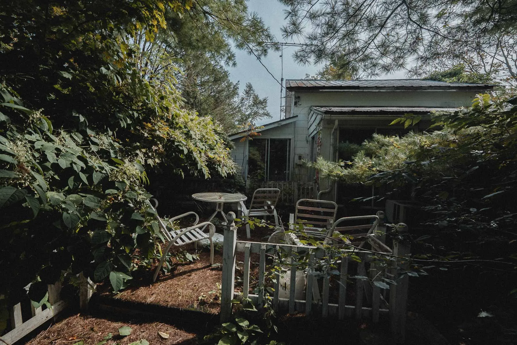 White lawn chairs near the Starcruiser House barn