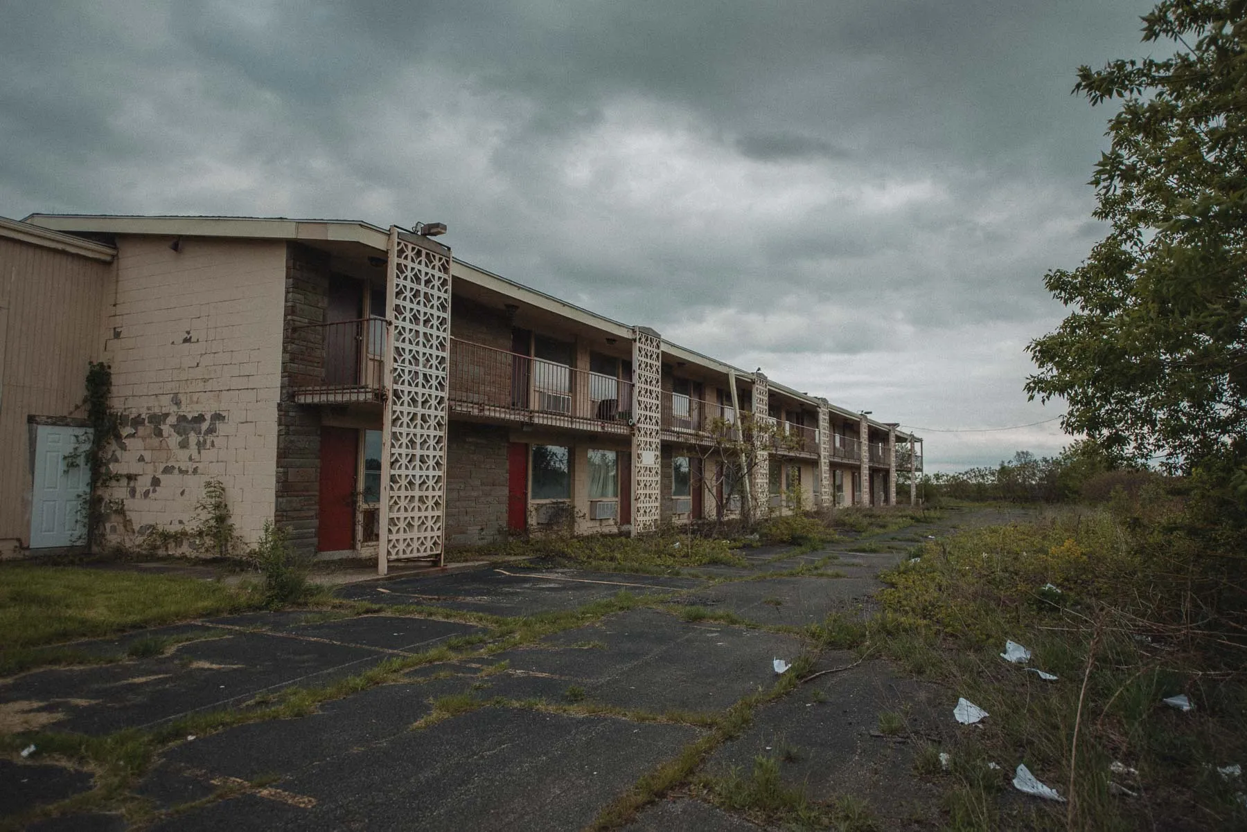 Concrete patios outside the rooms at the abandoned Vista Heights Inn