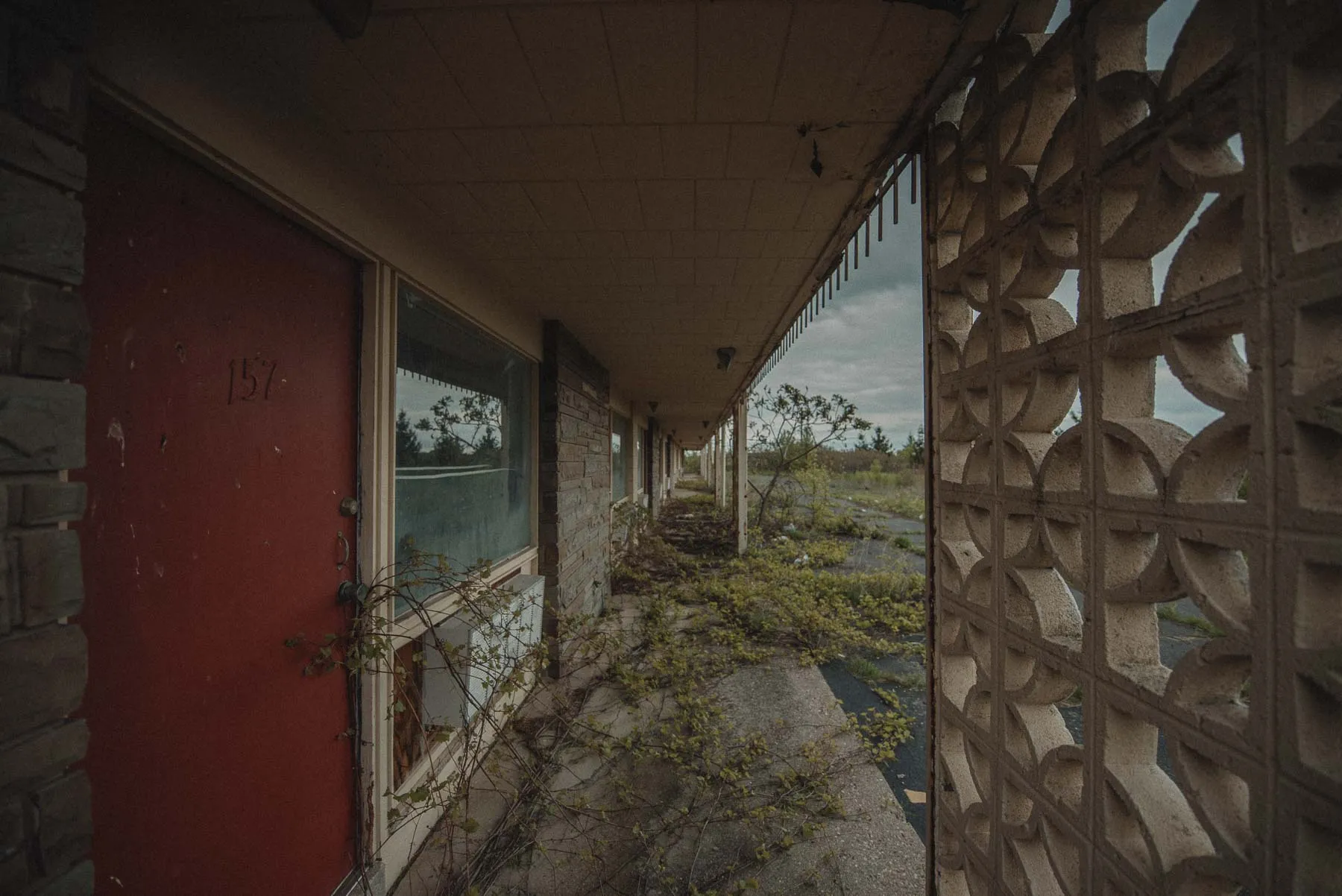 Row of exterior motel room doors at the abandoned Vista Heights Inn