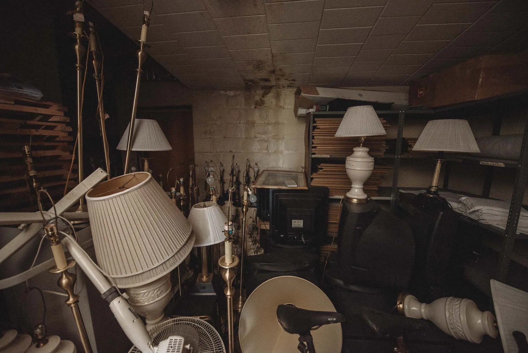 Storage room packed with spare furniture inside the abandoned Vista Heights Inn
